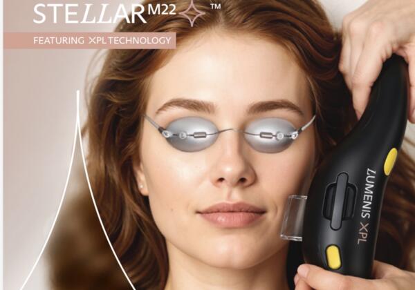 Practitioner treating a woman's cheek with the Lumenis XPL handpiece while she wears protective eye shields, Stellar M22 XPL technology